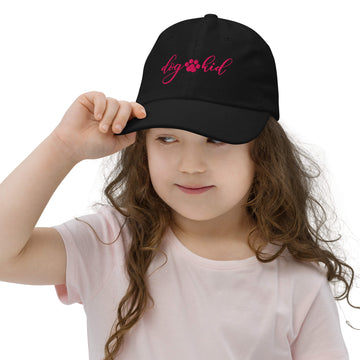 Girl wearing black DOG KID baseball cap with flamingo embroidery and adjustable fit