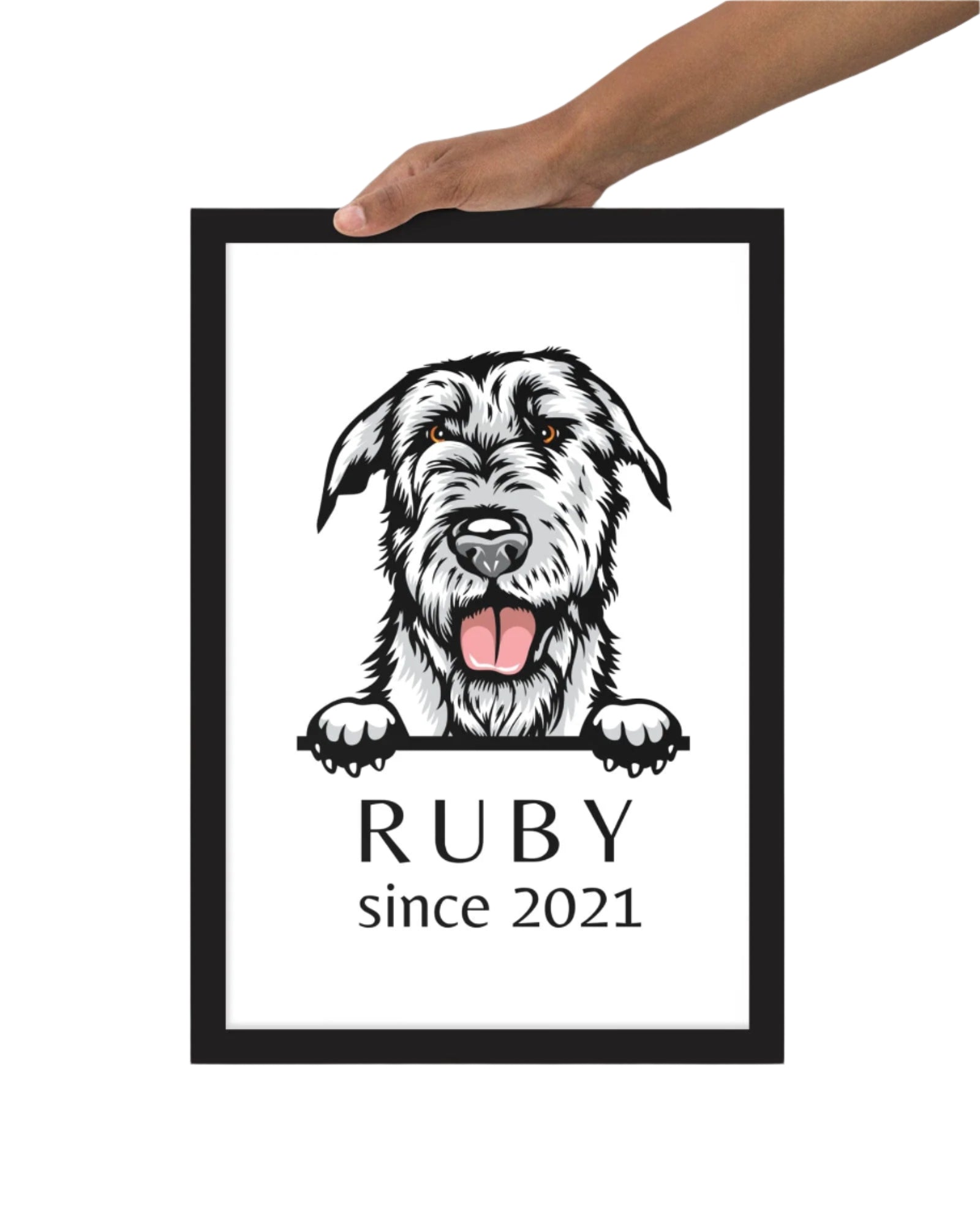 Hand holding 12x18 custom dog breed portrait showing large size framed artwork ready to hang with hardware